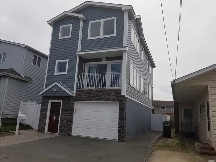 New Build!! Large Diamond condition Open Concept 3 story home. Spacious rear baydoor area for Indoor/Outdoor entertaining. Bright, sprawling LR/DR/EIK with Italian appliance. Large windows for natural light lovers! Parking for 3 cars. Near Train and all. All FEMA Compliant, Raised, Low Flood!!