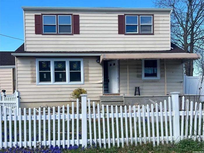 Finished Basement and Laundry Room. 1st Floor has 3 bedrooms, Fbth, Living Area, Eat-In-Kitchen,  2nd Floor has 3 bedrooms and full bath.