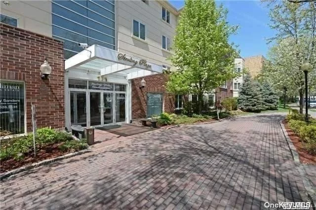 Luxury Living In The Heart Of Great Neck! 2 Bedroom 2.5 Bath Condo With 24 Hour Doorman/Concierge And Gym/Community Room! Gourmet Granite Eat-In-Kitchen With Maple Cabinetry And Stainless Steel Appliance. Split Bedrooms. Cherry Hardwood Floors Throughout, Marble Baths W/Jacuzzi Tub (Sep Stall Shower In Master) , Onyx Powder Room, Washer/Dryer in apartment CAC, Alarm, Dedicated Garage Parking. Walk to LIRR & Shops. Great Neck South Schools, Saddle Rock Elementary.